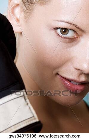 Portrait of a young woman smiling View Large Photo Image Stock Photograph - Portrait of a young woman smiling. Fotosearch