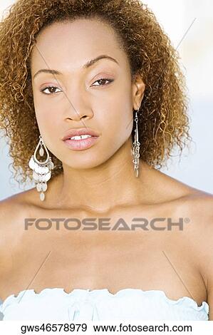 Portrait of a young woman View Large Photo Image Stock Photo - Portrait of a young woman. Fotosearch