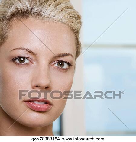 Picture - Portrait of a young woman thinking. Fotosearch