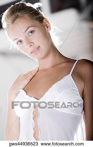 Portrait of a young woman wearing a nightie View Large Photo Image Stock Image - Portrait of a young woman wearing a nightie. Fotosearch