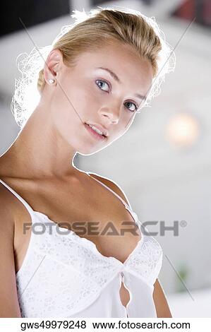 Portrait of a young woman wearing a nightie View Large Photo Image Stock Photo - Portrait of a young woman wearing a nightie. Fotosearch