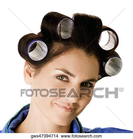 Portrait of a young woman with curlers in her hair View Large Photo Image Picture - Portrait of a young woman with curlers in her hair. Fotosearch