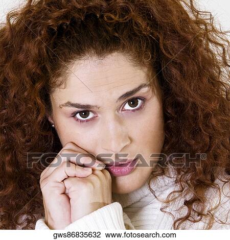 Portrait of a young woman with her hands clasped View Large Photo Image Stock Image - Portrait of a young woman with her hands clasped. Fotosearch