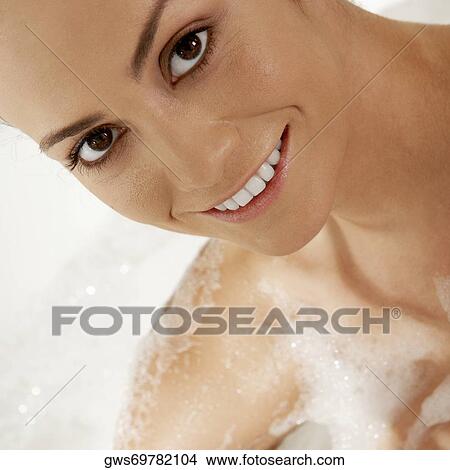 Portrait of a young woman with soap on her body View Large Photo Image Picture - Portrait of a young woman with soap on her body. Fotosearch