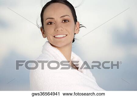 Portrait of a young woman wrapped in a towel View Large Photo Image Stock Image - Portrait of a young woman wrapped in a towel. Fotosearch
