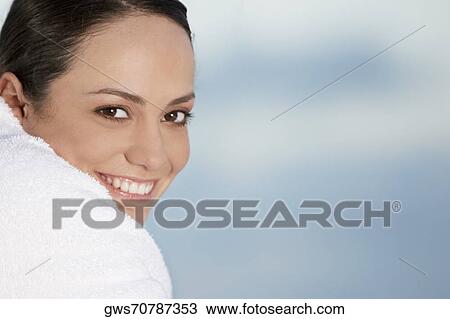 Portrait of a young woman wrapped in a towel View Large Photo Image Stock Image - Portrait of a young woman wrapped in a towel. Fotosearch