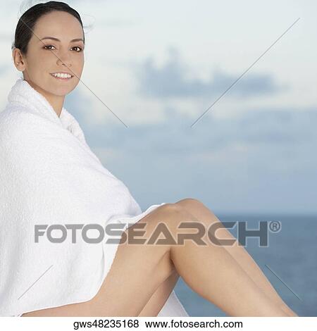 Portrait of a young woman wrapped in a towel View Large Photo Image Stock Photo - Portrait of a young woman wrapped in a towel. Fotosearch
