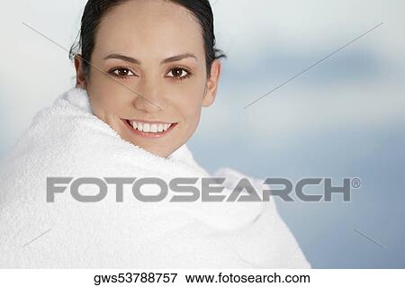 Portrait of a young woman wrapped in a towel View Large Photo Image Stock Photo - Portrait of a young woman wrapped in a towel. Fotosearch