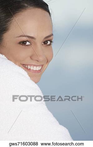 Portrait of a young woman wrapped in a towel View Large Photo Image Stock Photo - Portrait of a young woman wrapped in a towel. Fotosearch