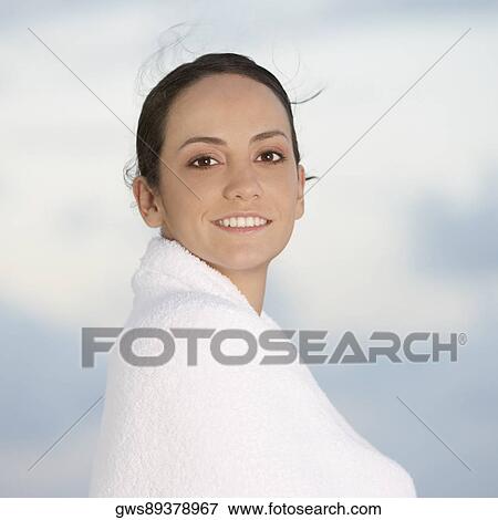 Portrait of a young woman wrapped in a towel View Large Photo Image Stock Photo - Portrait of a young woman wrapped in a towel. Fotosearch