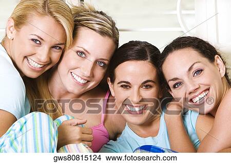 Portrait of four young women smiling View Large Photo Image Picture - Portrait of four young women smiling. Fotosearch