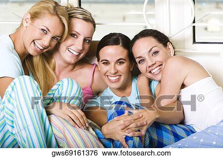 Portrait of four young women smiling View Large Photo Image Stock Photograph - Portrait of four young women smiling. Fotosearch