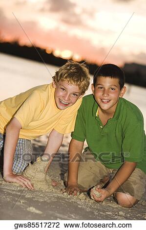 Portrait of two brothers smiling View Large Photo Image Stock Image - Portrait of two brothers smiling. Fotosearch