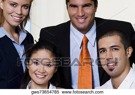 Portrait of two businesswomen and two businessmen smiling View Large Photo Image Stock Photography - Portrait of two businesswomen and two businessmen smiling. Fotosearch