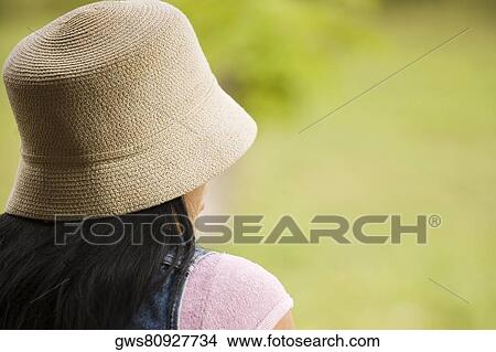Picture - Rear view of a young woman. Fotosearch