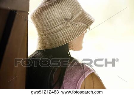 Rear view of a young woman View Large Photo Image Stock Image - Rear view of a young woman. Fotosearch