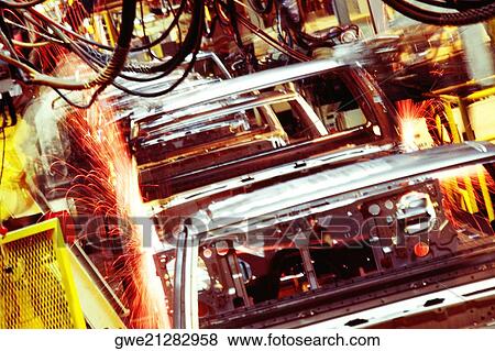 Robots welding a row of cars in an assembly line, Smyrna, Tennessee, USA View Large Photo Image Stock Photo - Robots welding a row of cars in an assembly line, Smyrna, Tennessee, USA. Fotosearch