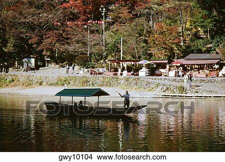 Picture - Sailor in a sailboat, Arashiyama, Kyoto, Japan. Fotosearch