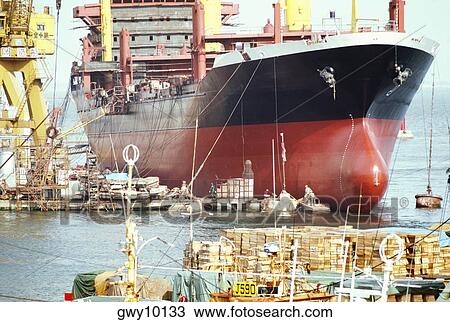 Stock Image - Ship anchored at a harbor, Supertanker Construction, Fukuoka, Japan. Fotosearch