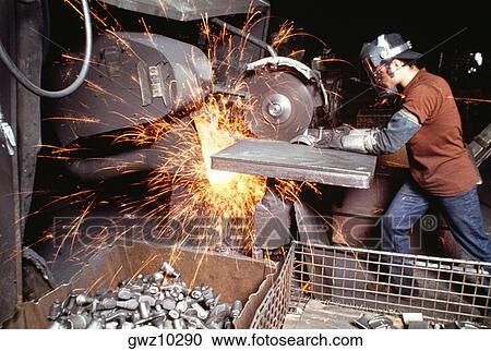 Side profile of a foundry worker working on a metal saw in a factory, Wisconsin, USA View Large Photo Image Stock Image - Side profile of a foundry worker working on a metal saw in a factory, Wisconsin, USA. Fotosearch