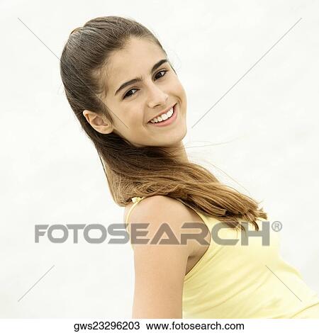 Stock Image - Side profile of a girl smiling. Fotosearch