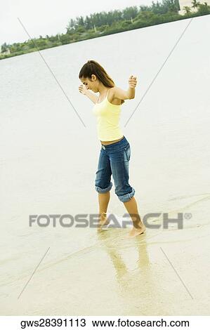 Side profile of a girl standing on the beach View Large Photo Image Stock Image - Side profile of a girl standing on the beach. Fotosearch