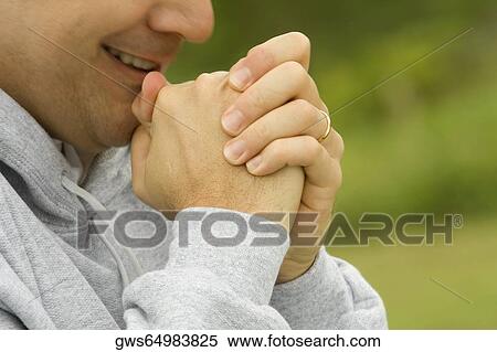 Side profile of a mature man with his hands clasped View Large Photo Image Stock Photography - Side profile of a mature man with his hands clasped. Fotosearch