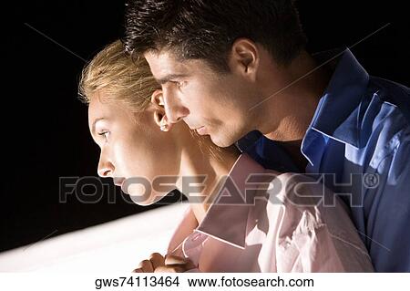 Side profile of a mid adult man embracing a young woman View Large Photo Image Picture - Side profile of a mid adult man embracing a young woman. Fotosearch