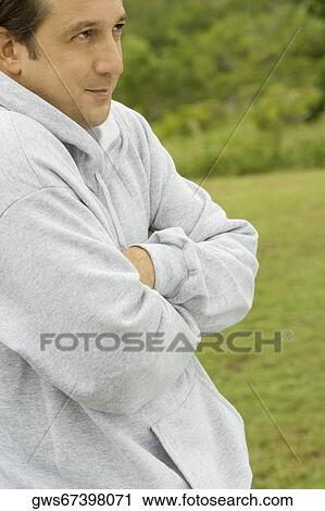 Side profile of a mid adult man with arms crossed View Large Photo Image Stock Image - Side profile of a mid adult man with arms crossed. Fotosearch