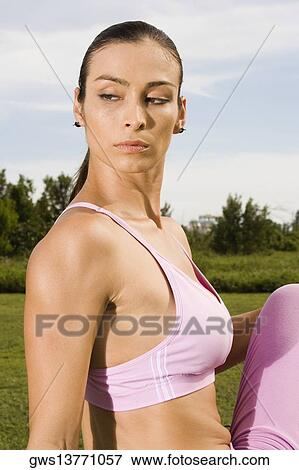 Side profile of a mid adult woman exercising View Large Photo Image Stock Photo - Side profile of a mid adult woman exercising. Fotosearch