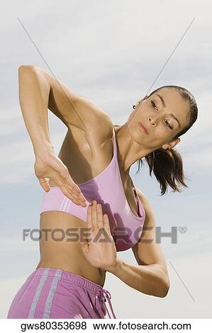 Side profile of a mid adult woman practicing martial arts View Large Photo Image Stock Photo - Side profile of a mid adult woman practicing martial arts. Fotosearch