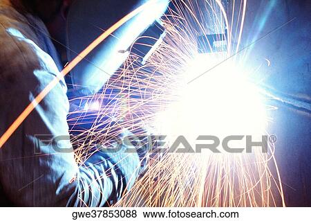 Side profile of a welder welding metal, Chicago, Illinois, USA View Large Photo Image Stock Photo - Side profile of a welder welding metal, Chicago, Illinois, USA. Fotosearch