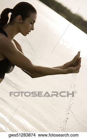 Side profile of a young woman exercising View Large Photo Image Picture - Side profile of a young woman exercising. Fotosearch