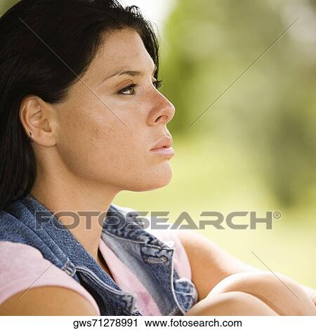 Side profile of a young woman looking serious View Large Photo Image Stock Image - Side profile of a young woman looking serious. Fotosearch