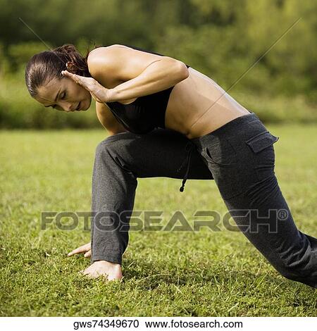 Side profile of a young woman practicing martial arts View Large Photo Image Stock Image - Side profile of a young woman practicing martial arts. Fotosearch