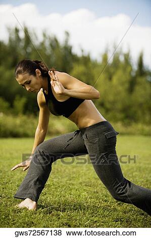 Side profile of a young woman practicing martial arts View Large Photo Image Stock Photo - Side profile of a young woman practicing martial arts. Fotosearch