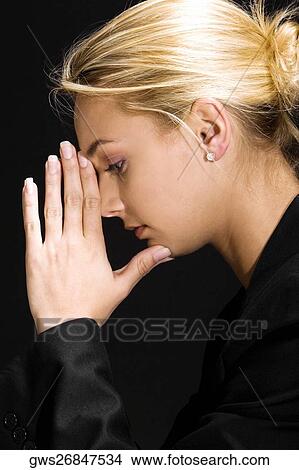 Side profile of a young woman thinking View Large Photo Image Picture - Side profile of a young woman thinking. Fotosearch