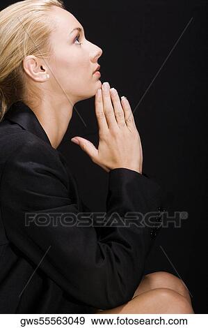 Side profile of a young woman thinking View Large Photo Image Stock Photo - Side profile of a young woman thinking. Fotosearch
