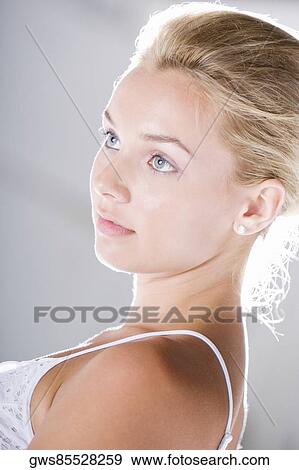 Side profile of a young woman thinking View Large Photo Image Stock Photo - Side profile of a young woman thinking. Fotosearch