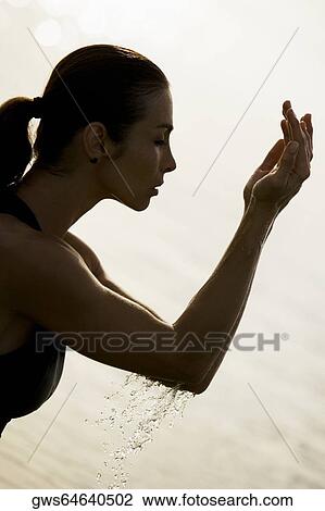 Side profile of a young woman with her eyes closed View Large Photo Image Stock Image - Side profile of a young woman with her eyes closed. Fotosearch