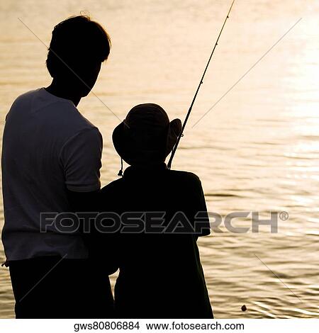 Picture - Silhouette of a father and his son fishing. Fotosearch