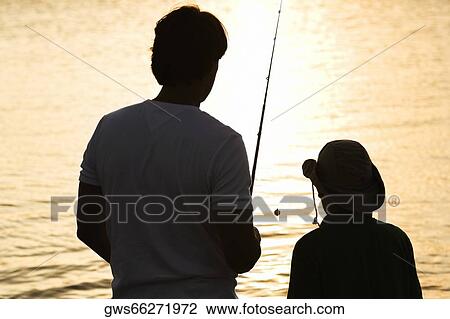 Silhouette of a father and his son fishing View Large Photo Image Stock Image - Silhouette of a father and his son fishing. Fotosearch