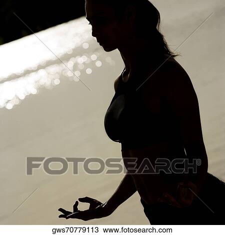 Silhouette of a young woman practicing martial arts View Large Photo Image Stock Image - Silhouette of a young woman practicing martial arts. Fotosearch