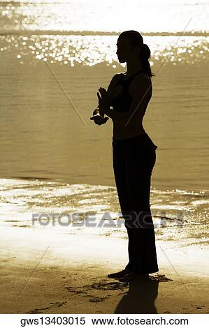 Silhouette of a young woman practicing martial arts on the beach View Large Photo Image Stock Photography - Silhouette of a young woman practicing martial arts on the beach. Fotosearch
