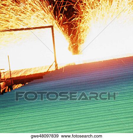 Steel beams on a cooling bed after being cut to proper lengths View Large Photo Image Stock Photo - Steel beams on a cooling bed after being cut to proper lengths. Fotosearch