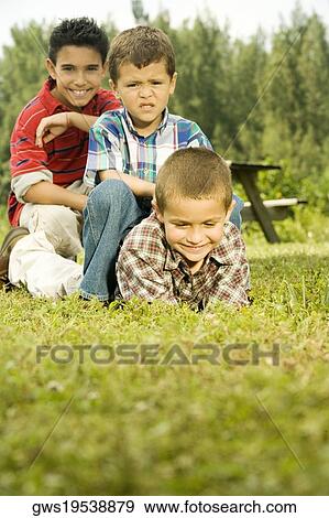 Three boys in the garden View Large Photo Image Stock Photo - Three boys in the garden. Fotosearch