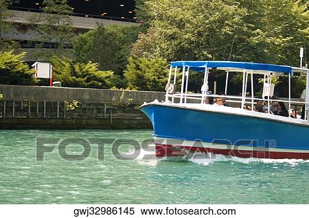 Tourists on a tour boat in the river, Chicago River, Chicago, Illinois, USA View Large Photo Image Stock Photography - Tourists on a tour boat in the river, Chicago River, Chicago, Illinois, USA. Fotosearch