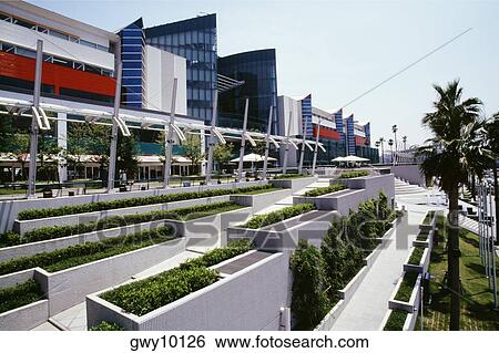 Stock Photograph - Trees in front of a building, Asia-Pacific Trade Center, Osaka, Japan. Fotosearch