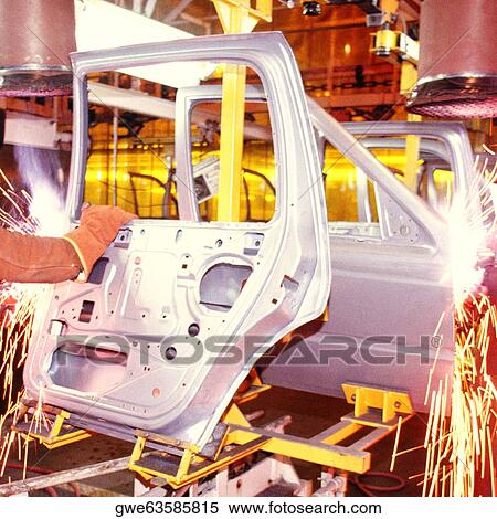 Welder working on car doors in an assembly line, Newark, Delaware, USA View Large Photo Image Stock Photography - Welder working on car doors in an assembly line, Newark, Delaware, USA. Fotosearch