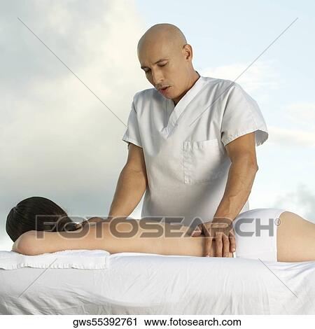 Young woman getting a back massage View Large Photo Image Stock Image - Young woman getting a back massage. Fotosearch